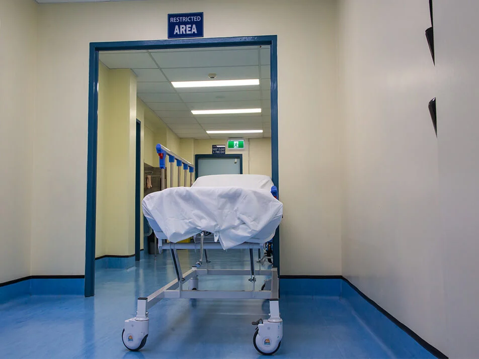 stretcher bed in hospital hallway